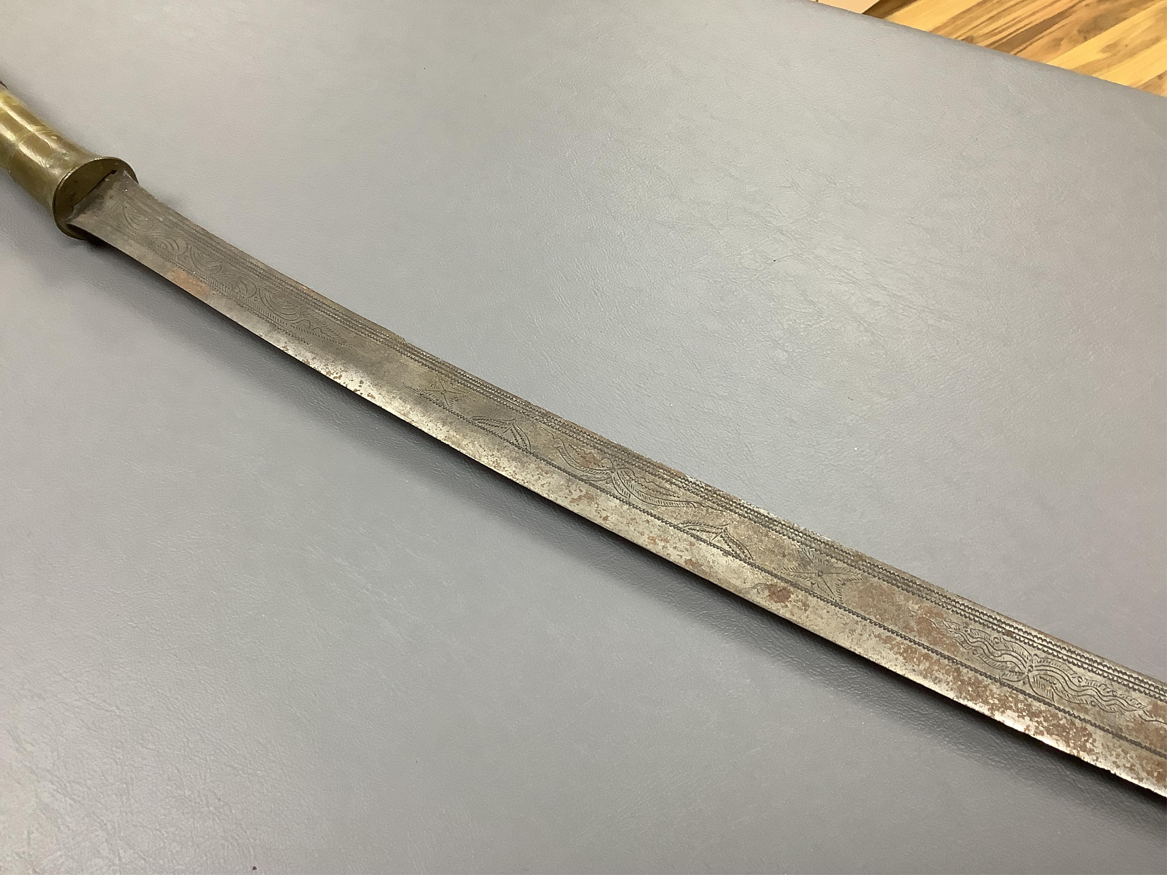 Eighteen assorted world weapons comprising a silver jambya (pommel missing), a knobkerry, a dha, two kris (one with handle missing), a lohar, three kukris, a djambok, a Chinese trousse, a chora, a flyssa, five others and